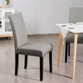Sedie da pranzo in tessuto imbottite con borchie decorative